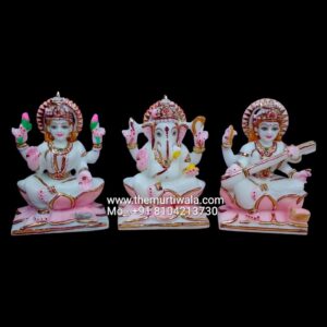 Marble statues of Lakshmi, Ganesha, and Saraswati
